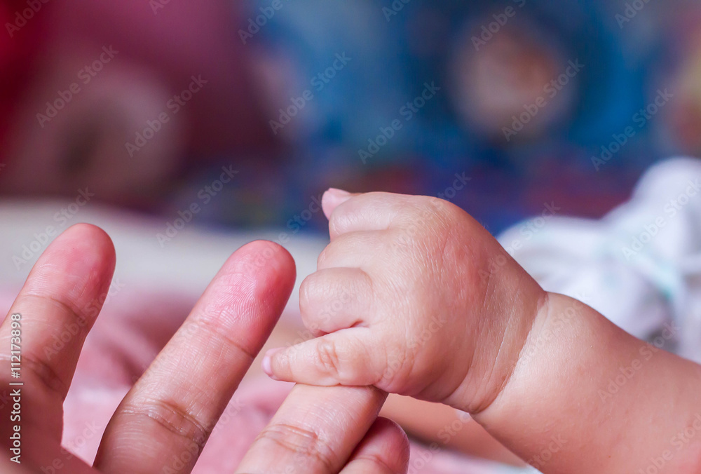 Small delicate little hand of newborn - close portrait Small delicate little hand of newborn - close portrait