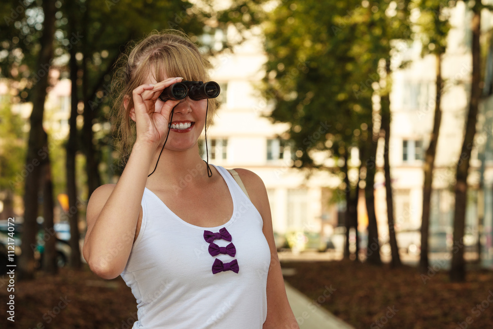 tourist woman looking through binoculars n city tourist woman looking through binoculars n city