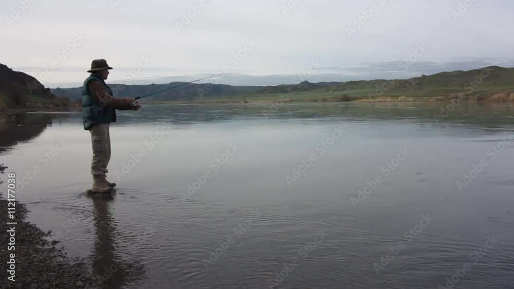 Fisherman fishing early in the morning on the river
Fisherman fishing early in the morning on the river
