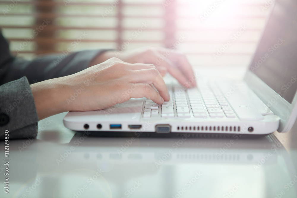 business woman hand typing on laptop keyboard business woman hand typing on laptop keyboard