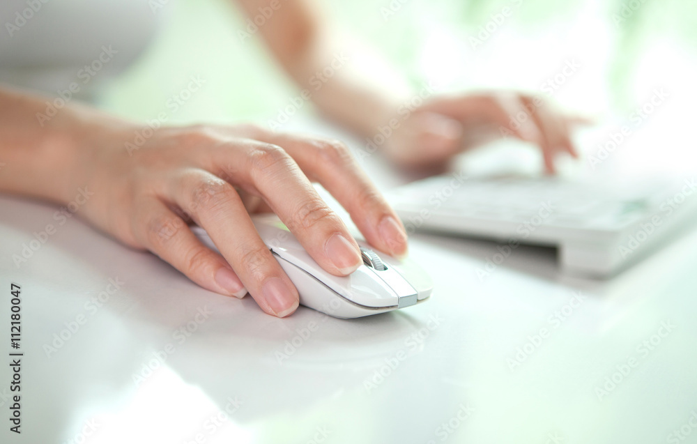 Fototapeta premium business woman hand typing on laptop keyboard and click mouse