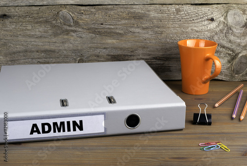 Admin - folder on wooden office desk