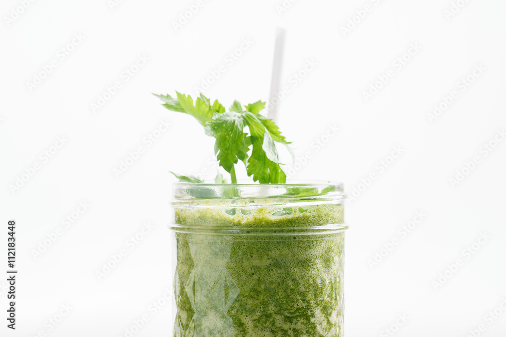 Fresh green juice smoothie made with organic green fruits and ve Fresh green juice smoothie made with organic green fruits and ve