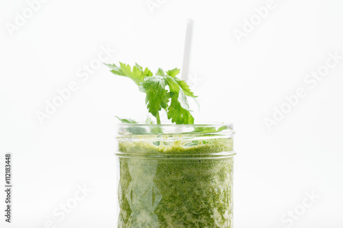 Fresh green juice smoothie made with organic green fruits and ve