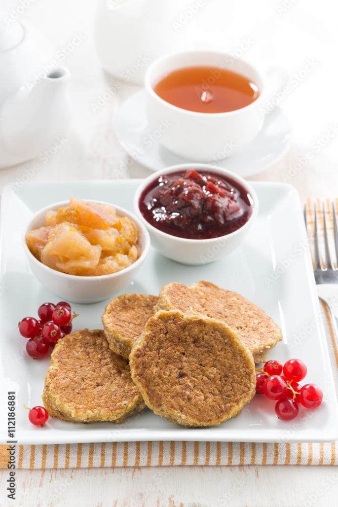 breakfast with homemade pancakes and jams, vertical breakfast with homemade pancakes and jams, vertical