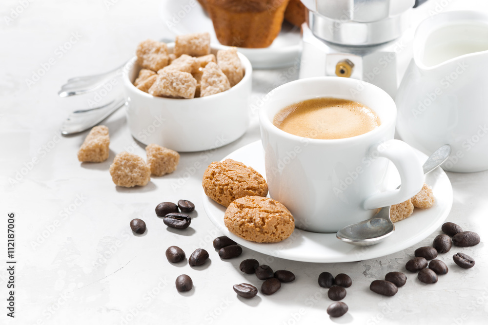 Fototapeta premium cup of espresso and cookies on a white table