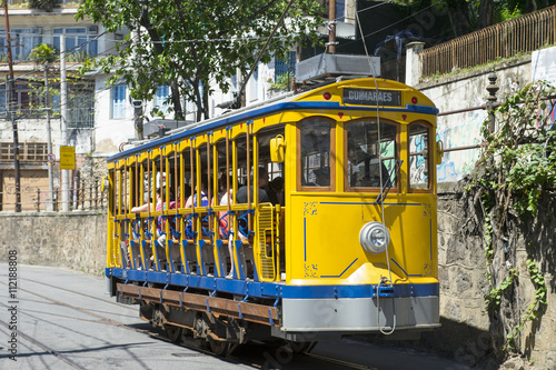 Iconic bonde tram travels along the streets of the tourist nieghborhood of Santa Teresa in Rio de Janeiro, Brazil 