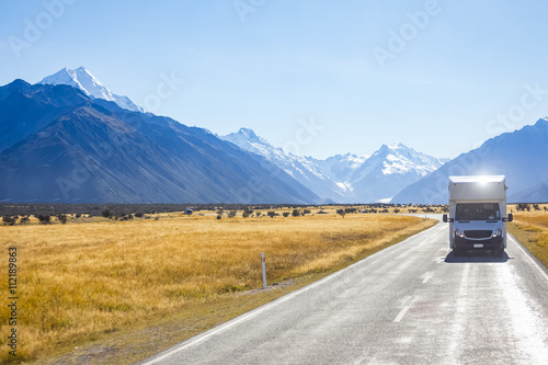 campervan on road with mountain view