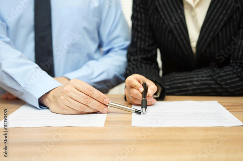 Business people discussing about contract, manager pointing on c