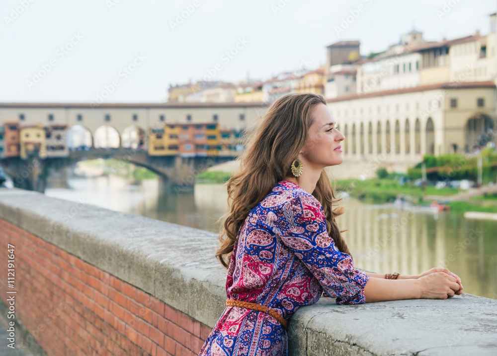 Portrait of pensive woman on embankment near Ponte Vecchio