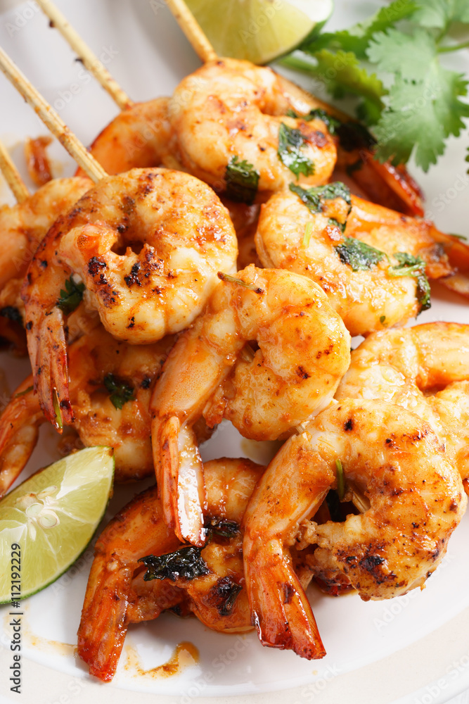 grilled shrimp kababs with sriracha and lime. grilled shrimp kababs with sriracha and lime.