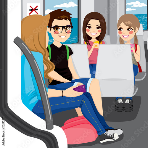 Young teenagers commuting by train sitting talking and communicating with their smartphones