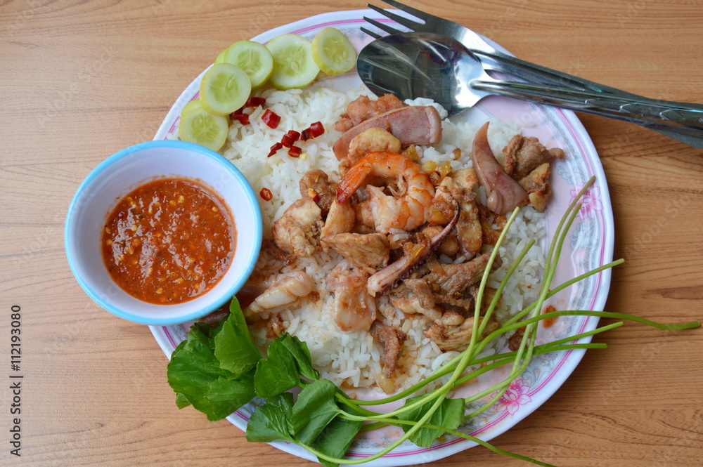 fried mixed seafood and meat with garlic on rice fried mixed seafood and meat with garlic on rice