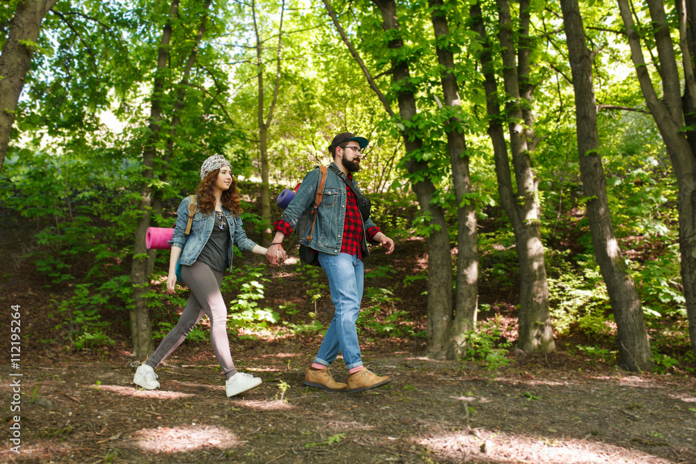 couple in the forest. campaign. happy people in the country. active lifestyle couple in the forest. campaign. happy people in the country. active lifestyle