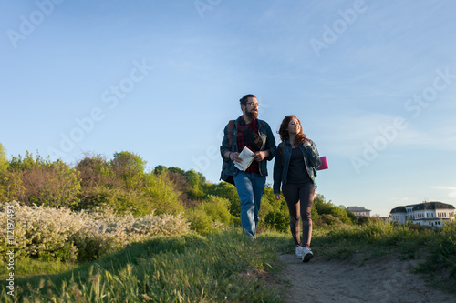 couple goes hiking, forest, recreation, love, active lifestyle, the concept of love and traveling