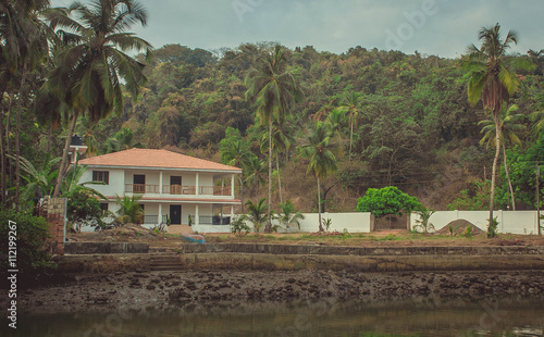 House near the river. Siolim, Goa, India photo