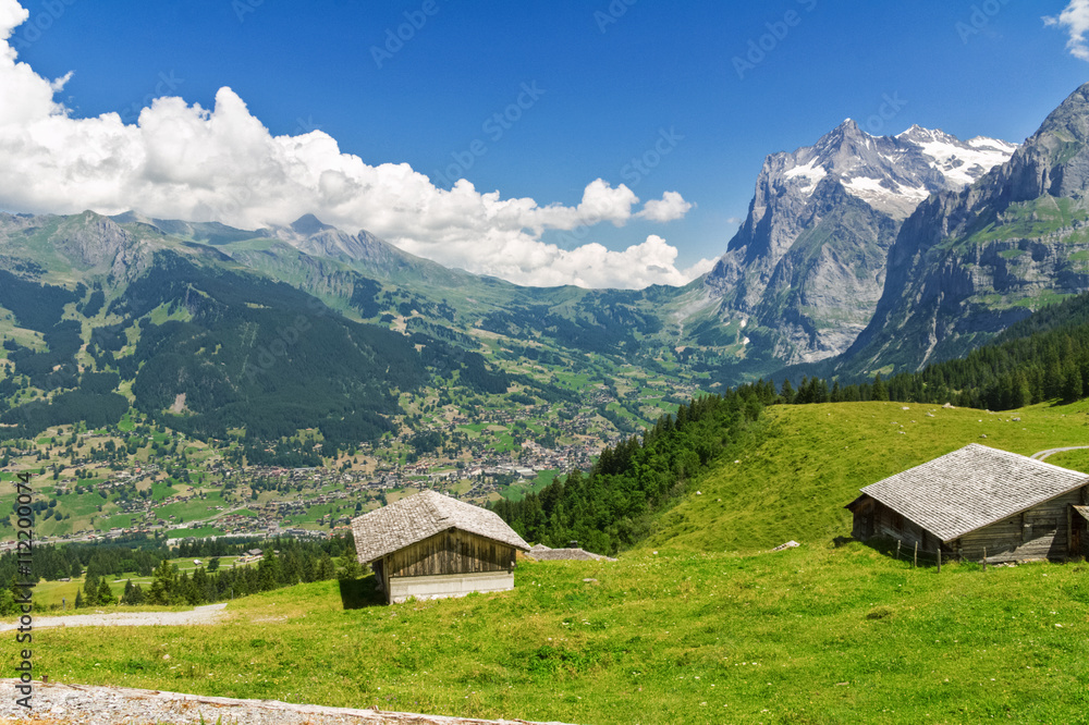 Beautiful idyllic mountains landscape with country house (chalet) in summer, Alps, Switzerland
