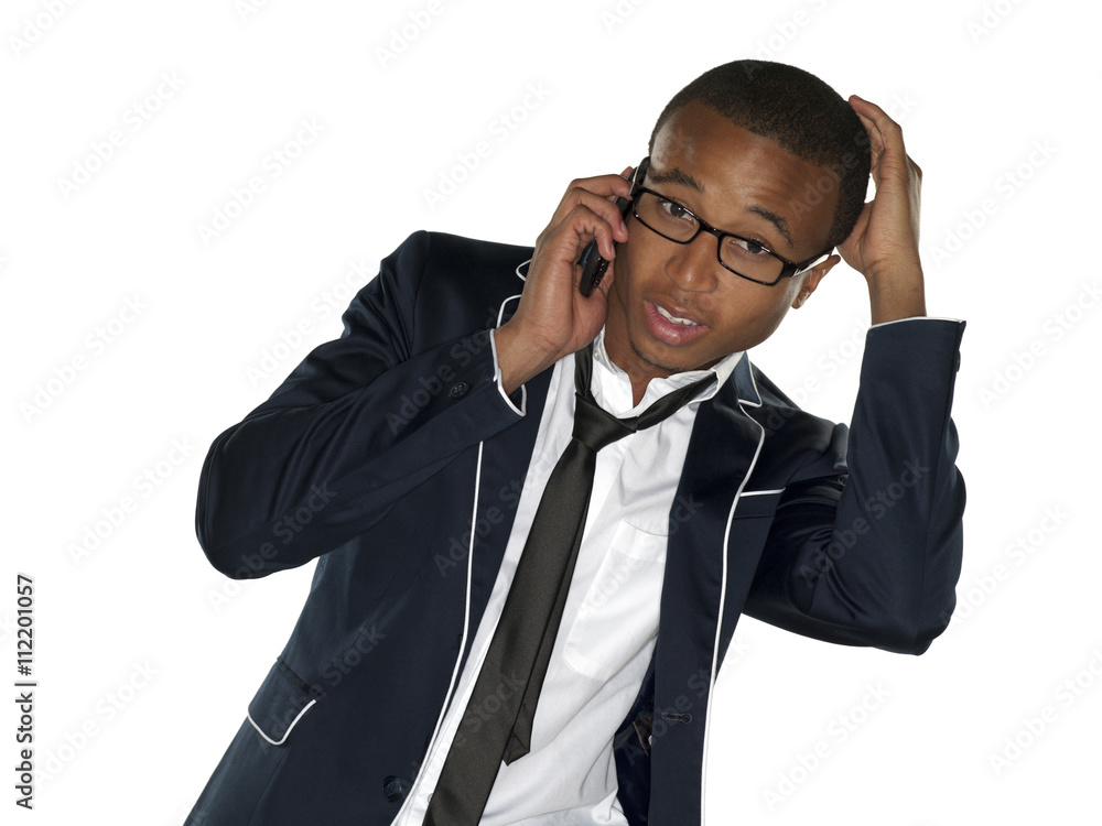 portrait of a businessman talking on phone and scratching head. portrait of a businessman talking on phone and scratching head.