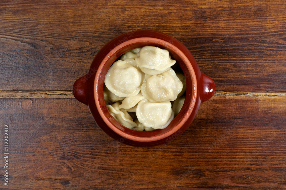 Russian dumplings in clay pot Russian dumplings in clay pot
