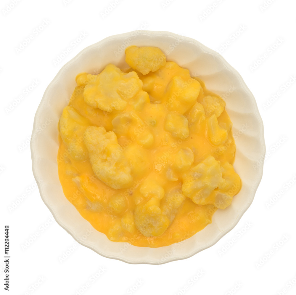 Top view of a serving of cauliflower with a cheese sauce in a bowl isolated on a white background Top view of a serving of cauliflower with a cheese sauce in a bowl isolated on a white background