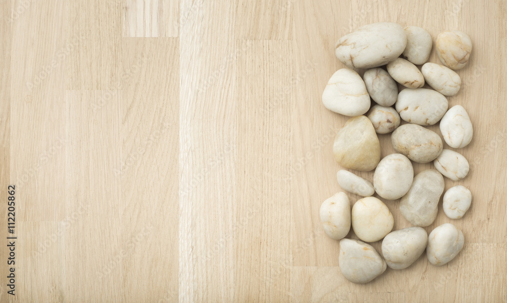 Stones on wooden background, concept of harmony and tranquility. Decoration with stone pebbles as natural design backdrop with copy space. Stones on wooden background, concept of harmony and tranquility. Decoration with stone pebbles as natural design backdrop with copy space.