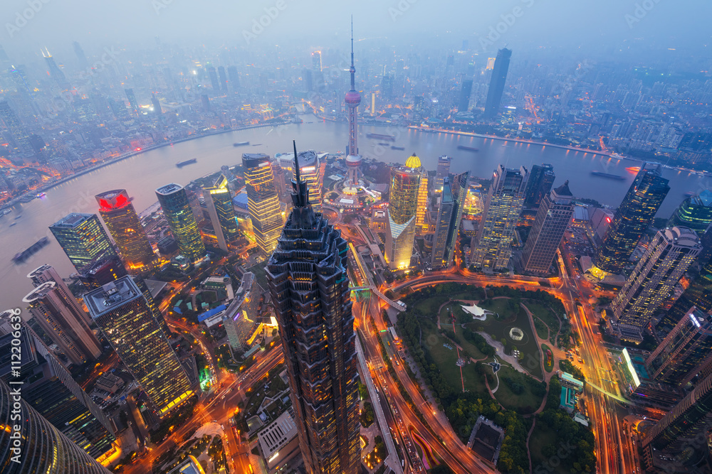 Obraz premium Elevated view of Lujiazui district in Shanghai, in Mao Tower in the foreground. Lujiazui has been developed specifically as a new financial district of Shanghai.