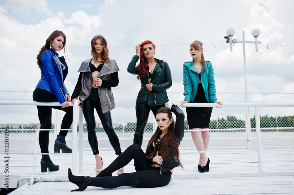 Fototapeta premium Group of sexy models girls in black bra and leather jackets on t