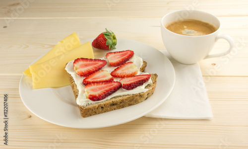 Coffee  cheese  bread with strawberry for breakfast on table