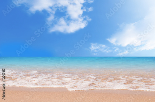 Wave & Sand beach with blue sky background
