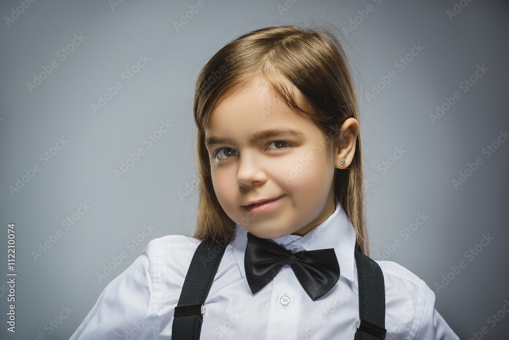 Happy girl. Closeup Portrait of handsome teen in casual shirt smiling isolated on grey background Happy girl. Closeup Portrait of handsome teen in casual shirt smiling isolated on grey background