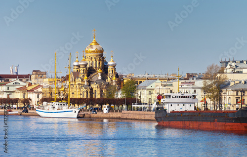 St. Petersburg. View from the Neva River on golden domes of the Cathedral of the Assumption of the Blessed Virgin Mary and Lieutenant Schmidt Embankment in spring