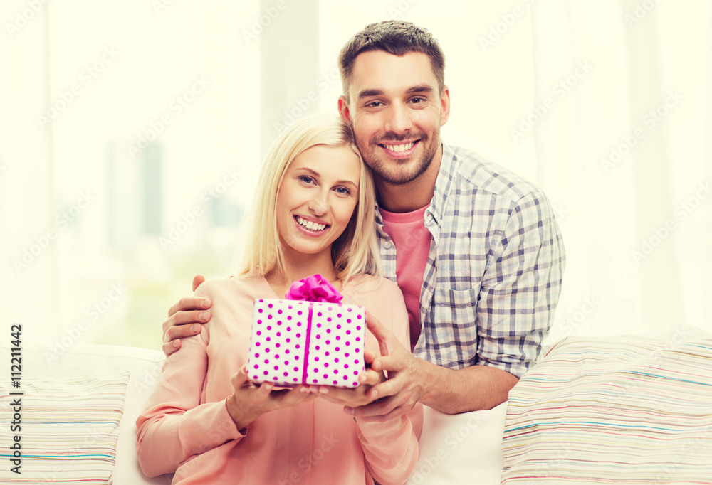 happy man giving woman gift box at home happy man giving woman gift box at home