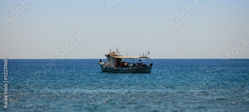 Fisher boat sailing on water