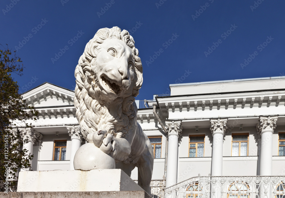St. Petersburg. Sculpture of a lion at the stairs Elaginsky Palace against the blue sky