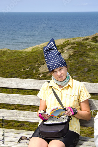 Holidaymaker takes a break by the sea