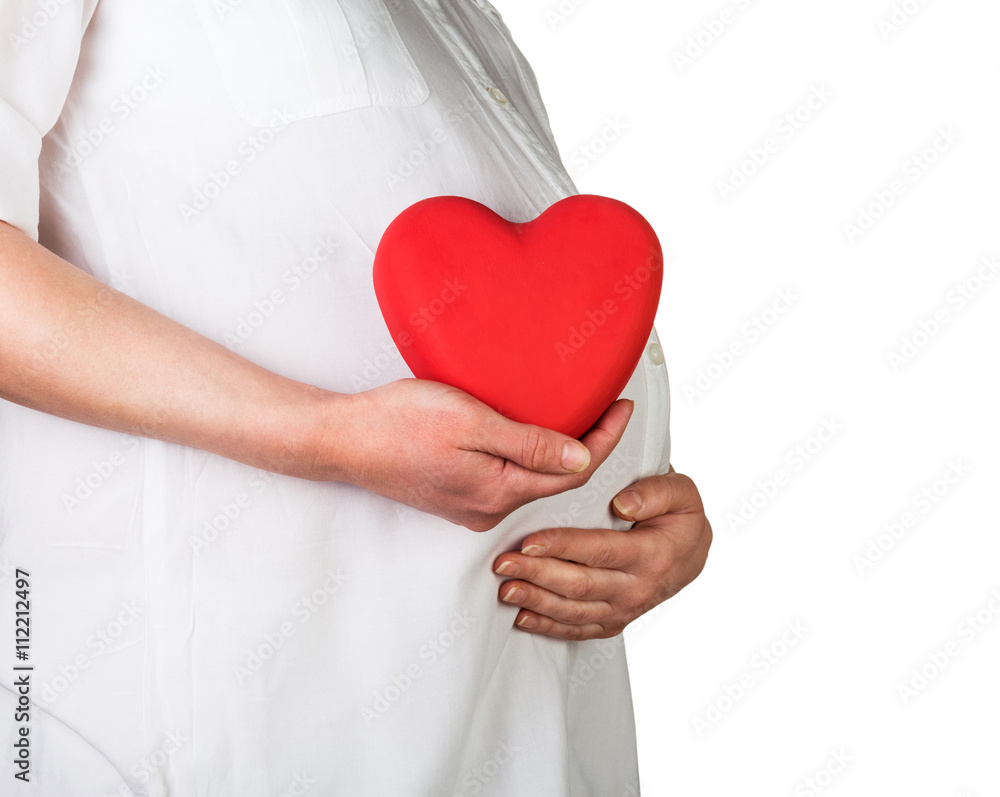 Pregnant woman holds in hand red heart isolated on white. Pregnant woman holds in hand red heart isolated on white.