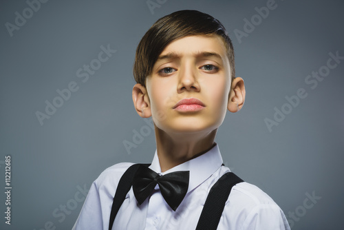 Φωτογραφία Closeup defiant boy with worried stressed face expression