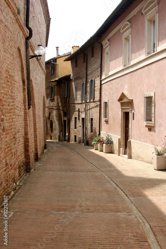 Lane in Urbino  with small street and little buildings of red bricks  Italy