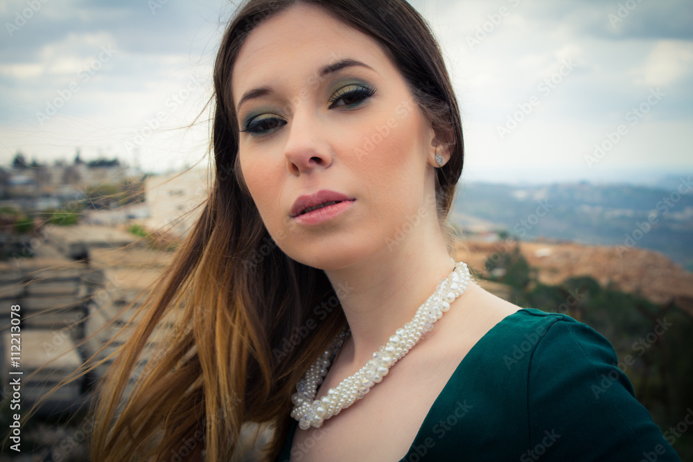 Beautiful brunette woman posing outdoor in abandoned industrial Beautiful brunette woman posing outdoor in abandoned industrial