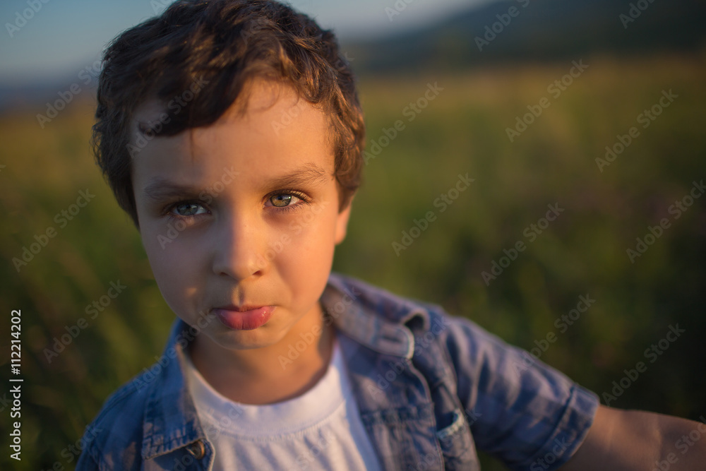 Portrait of a cute little boy in a nature Portrait of a cute little boy in a nature