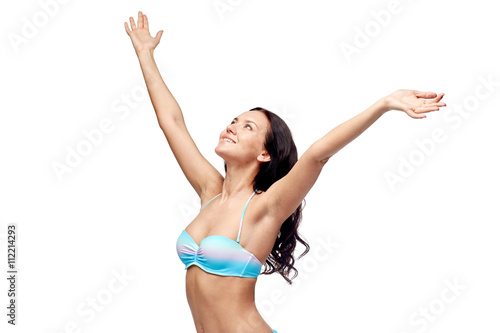 happy woman in bikini swimsuit with raised hands