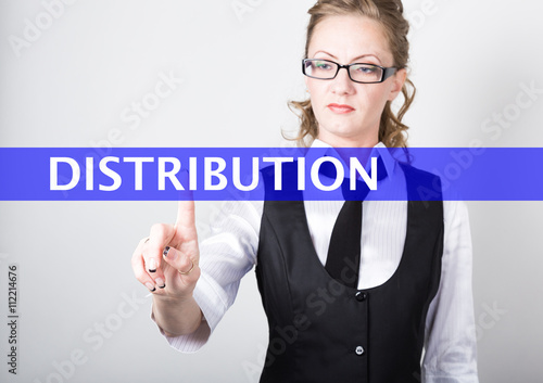 distribution written on a virtual screen. Internet technologies in business and tourism. woman in business suit and tie, presses a finger on a virtual screen