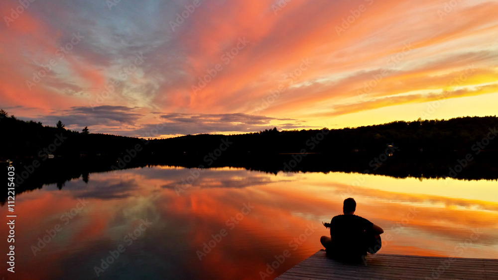 Fototapeta premium Beautiful cottage sunset on the dock