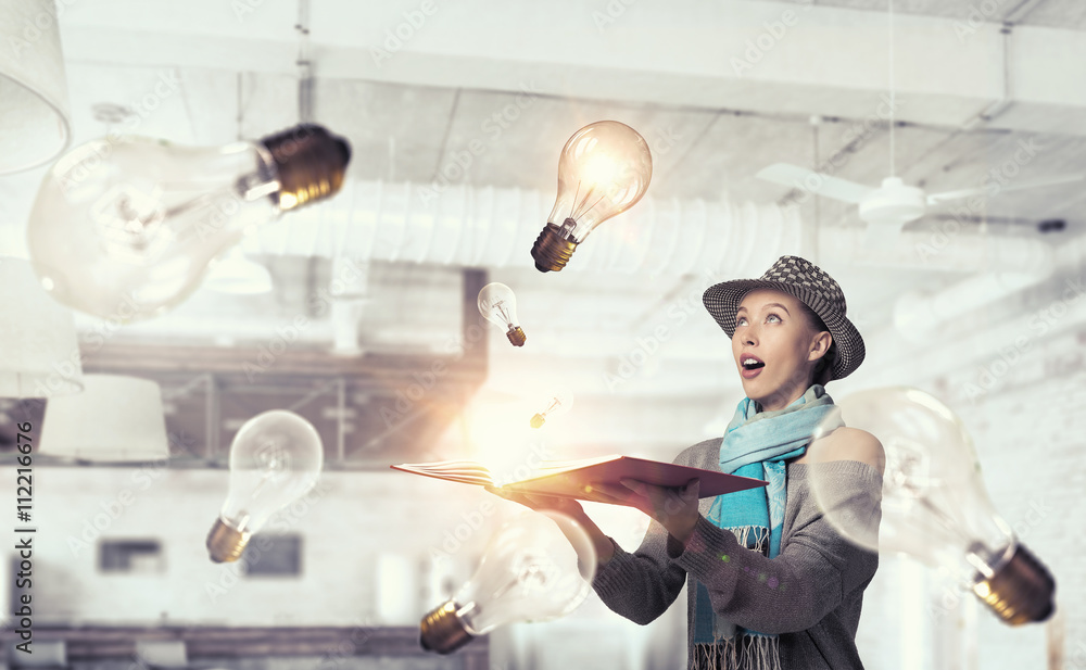Fototapeta premium Student girl with book in hands