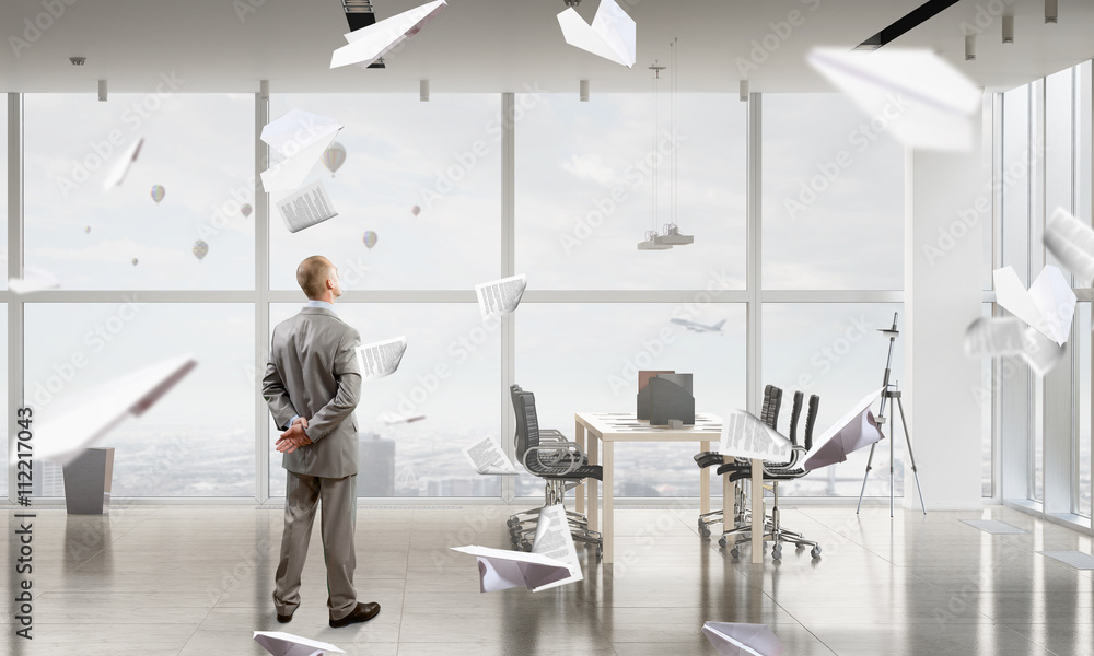 Businessman in office interior Businessman in office interior