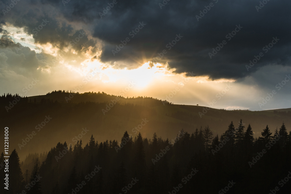 Storm clouds over mountains and the forest Storm clouds over mountains and the forest