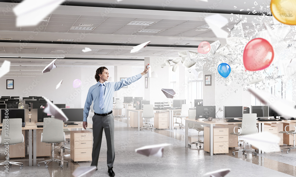 Fototapeta premium Businessman with aerosol can