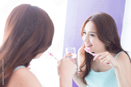 Smile woman brush teeth