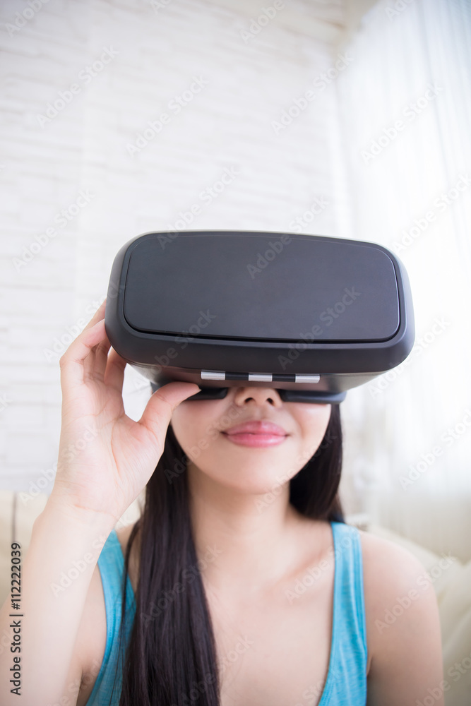 woman using VR headset glasses woman using VR headset glasses