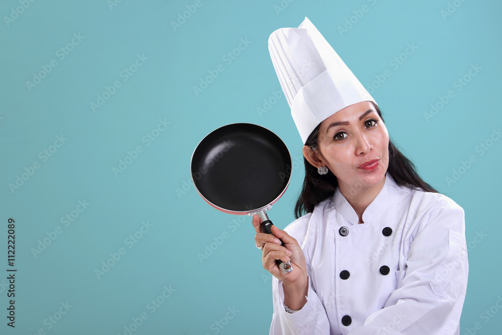 Chef holding a cooking pan, blue background Chef holding a cooking pan, blue background